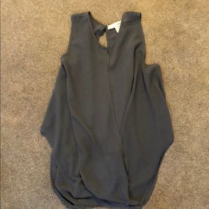 Sleeveless blouse with front and back slit